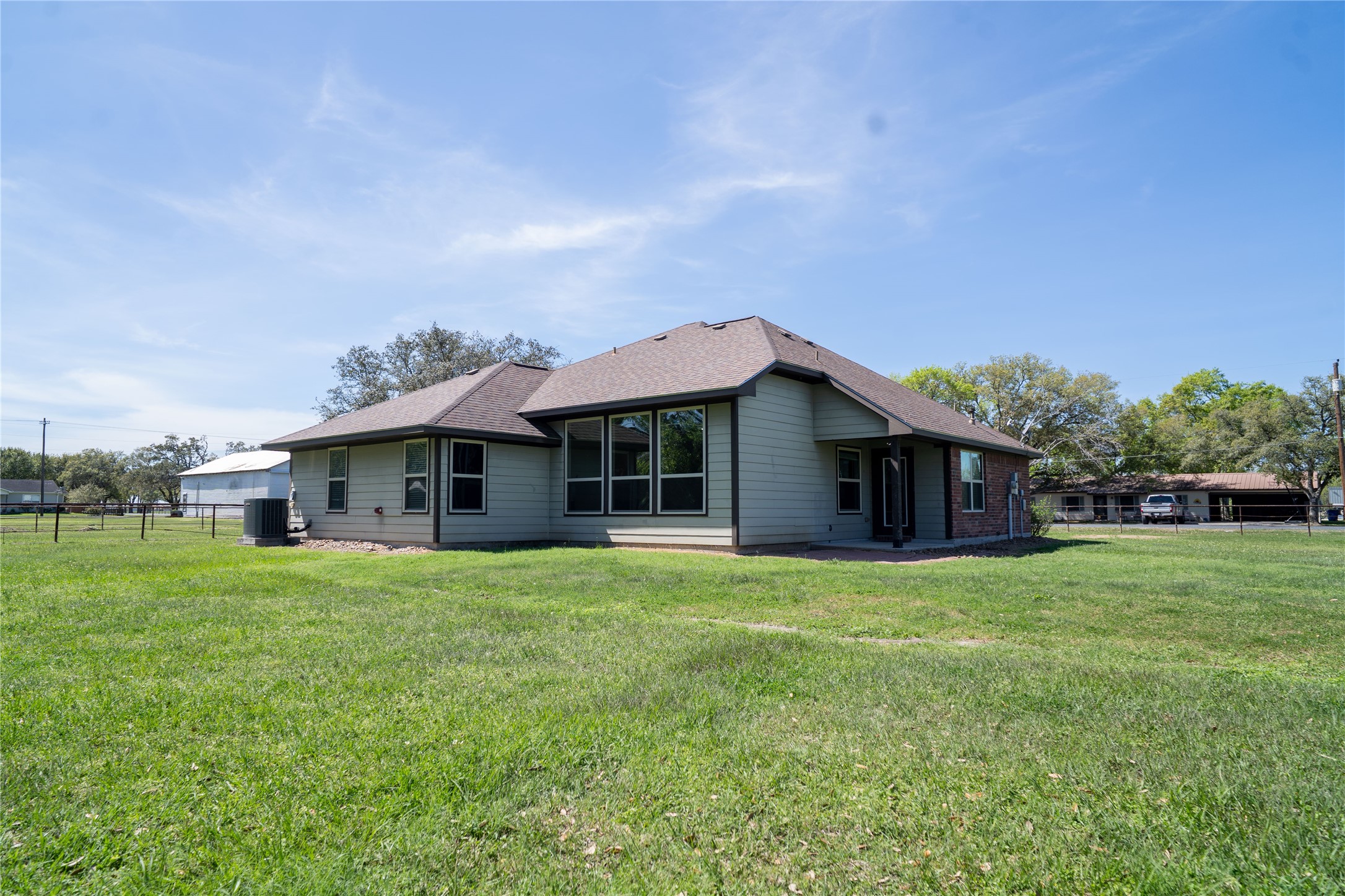 119 Hackberry Street Louise, TX 77455 - Photo 30 of 31 a front view of a house with a garden