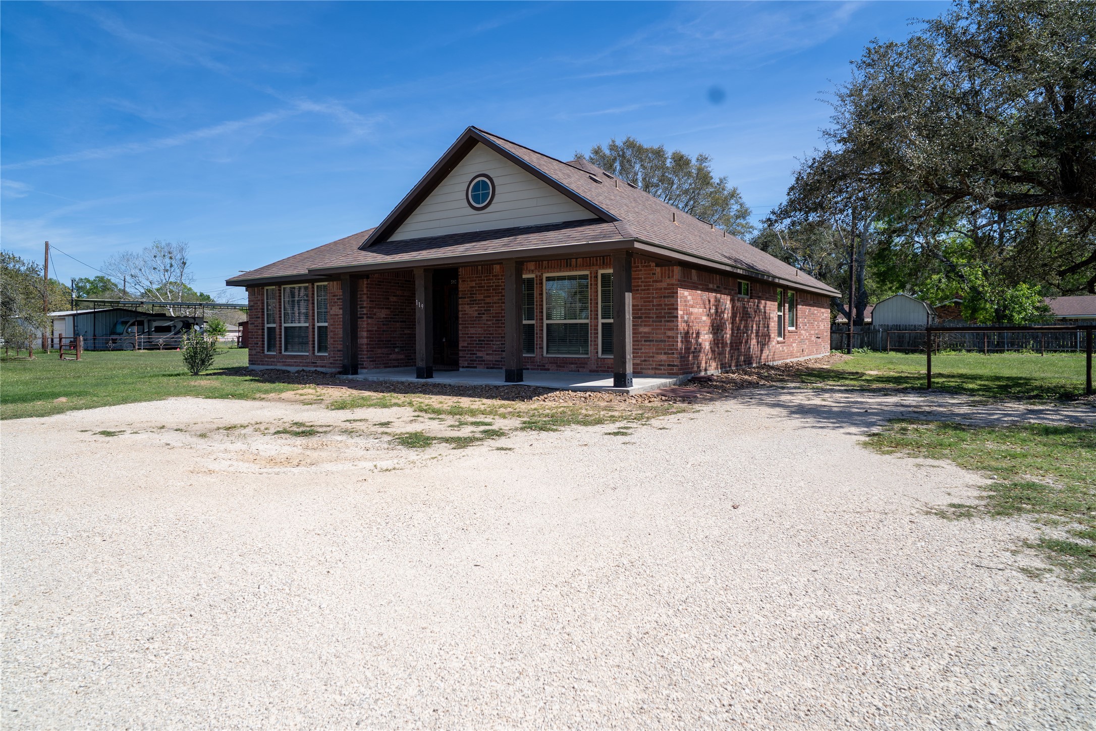 119 Hackberry Street Louise, TX 77455 - Photo 3 of 31 a front view of a house with a yard