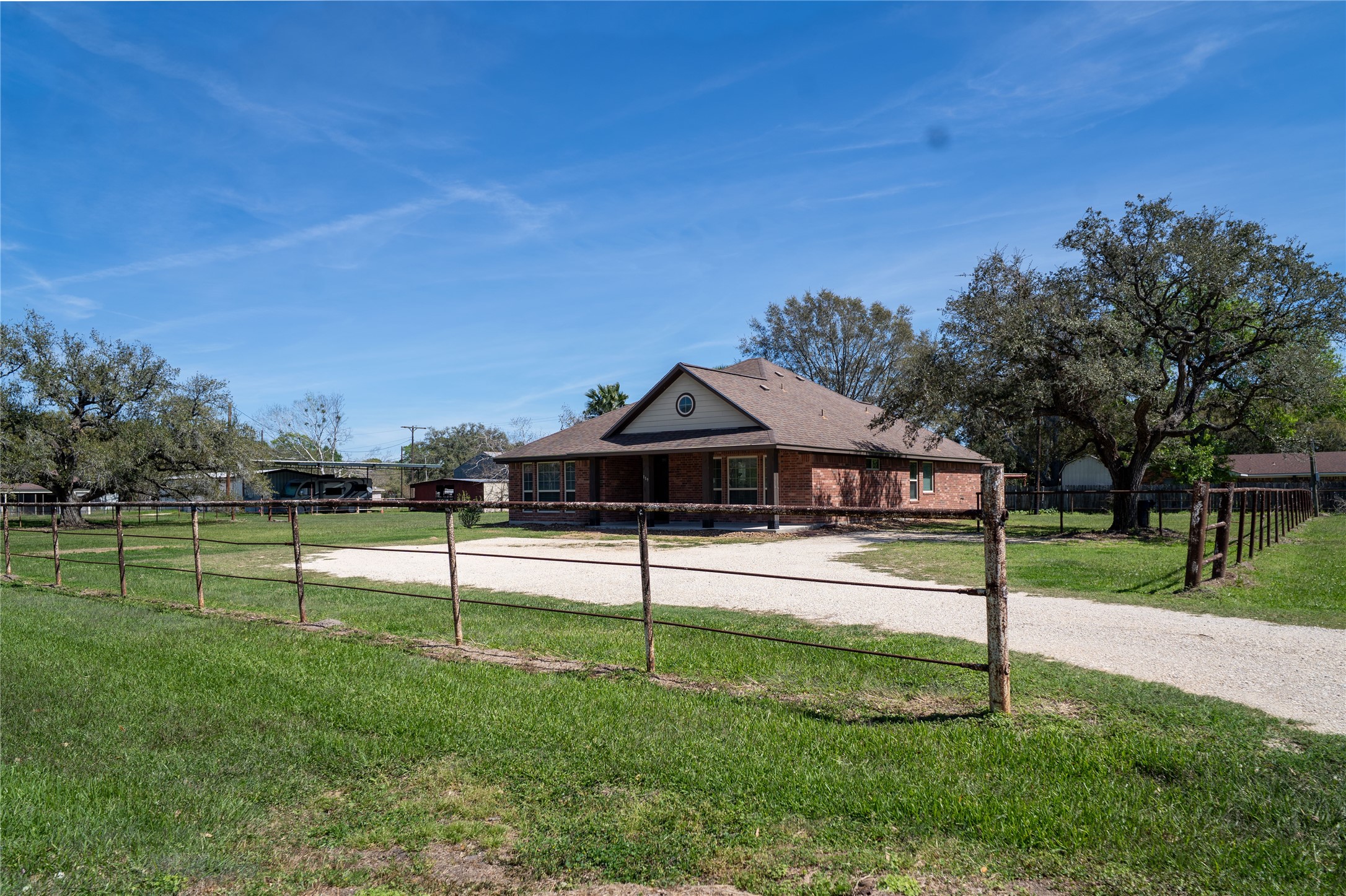 119 Hackberry Street Louise, TX 77455 - Photo 4 of 31 a view of a house with a backyard