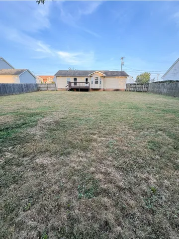a view of a field with an ocean