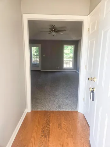 a view of a hallway with a window