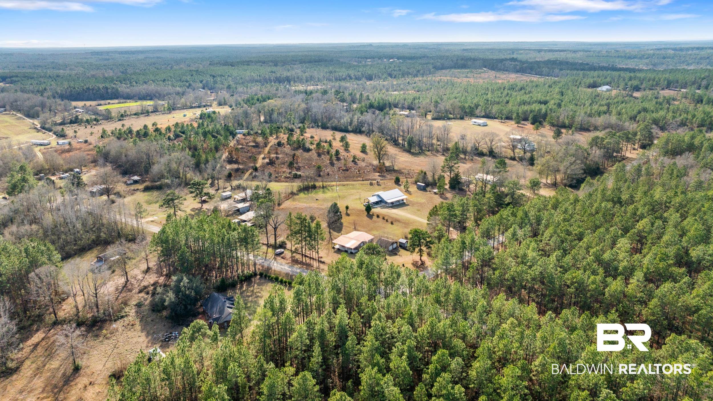 57623 Mary Hadley Road Perdido, AL 36562 - Photo 28 of 34 Aerial view of property's location featuring a heavily wooded area
