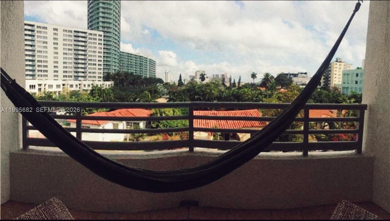 1401 Bay Road, Unit 412 Miami Beach, FL 33139 - Photo 9 of 9 a view of a balcony with chairs