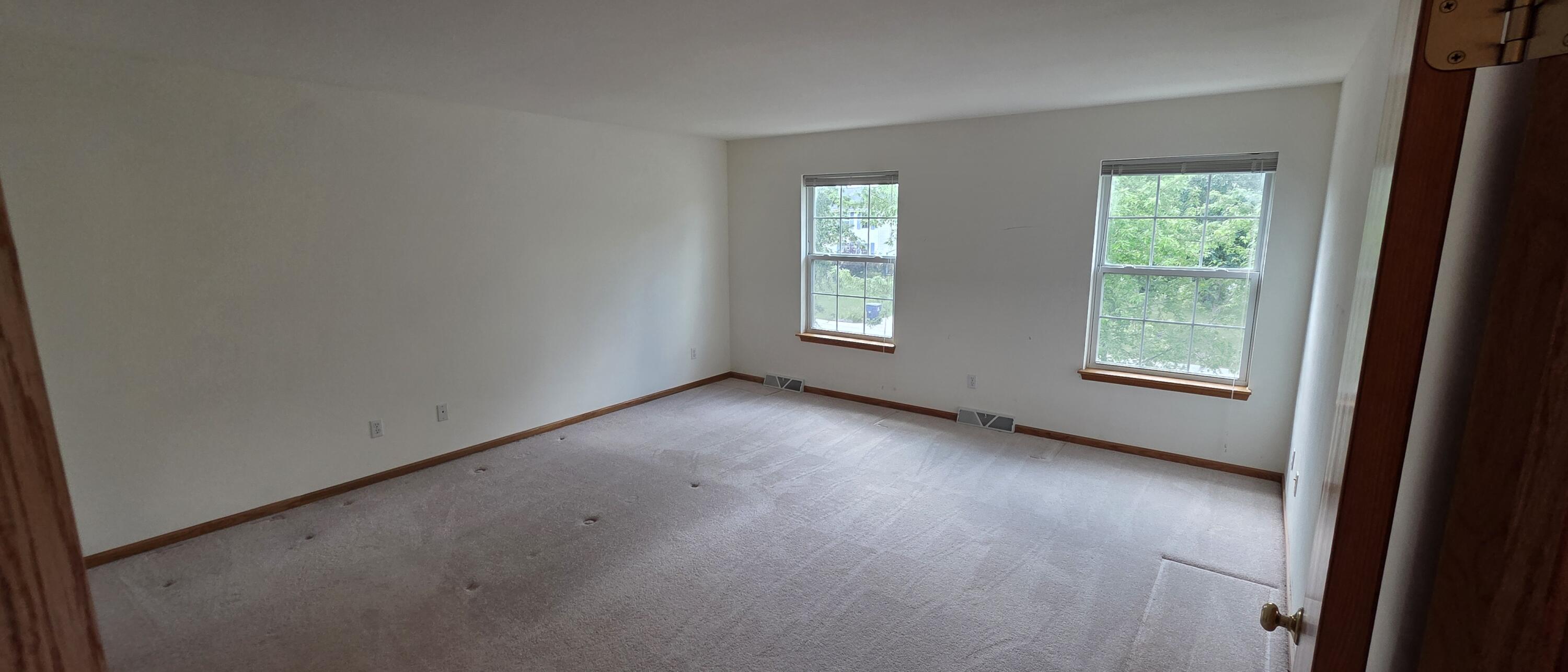 588 East Randy Road Oak Creek, WI 53154 - Photo 19 of 34 Primary Bedroom w Natural Light