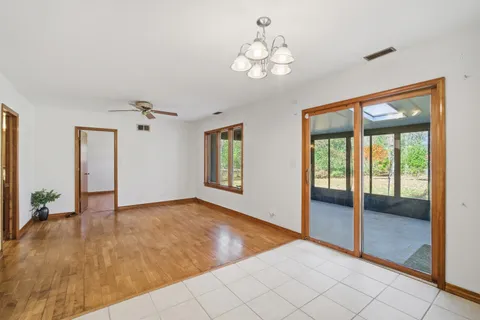 a living room with furniture and floor to ceiling windows