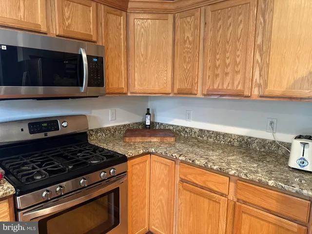 a white toilet sitting next to a window