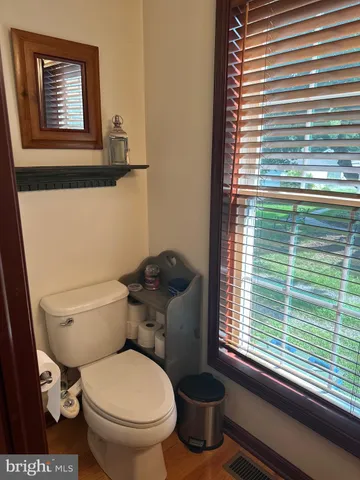 a view of a patio with a table and chairs