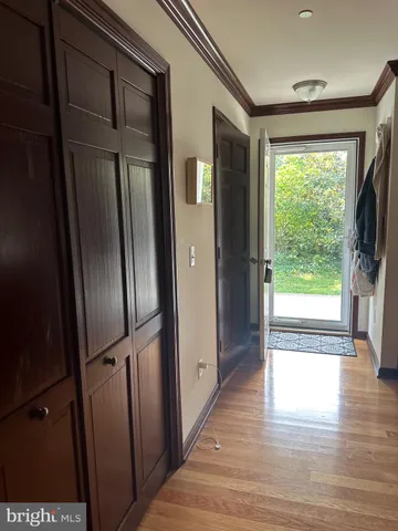 a view of entryway with wooden floor