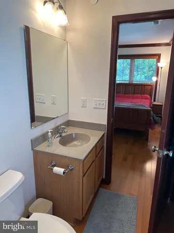 a view of a house with a patio and a yard