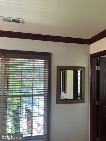 a view of a house with wooden deck