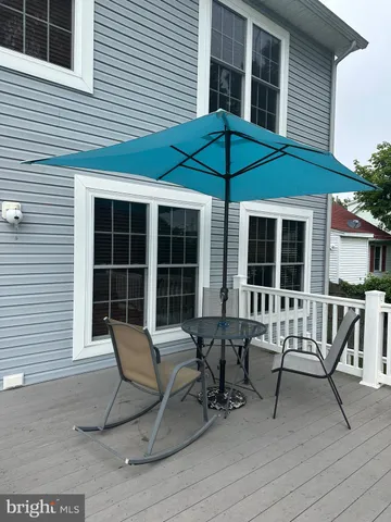 a view of a room with a table and chairs