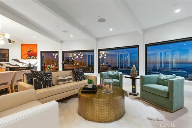 a bedroom with furniture and a flat screen tv