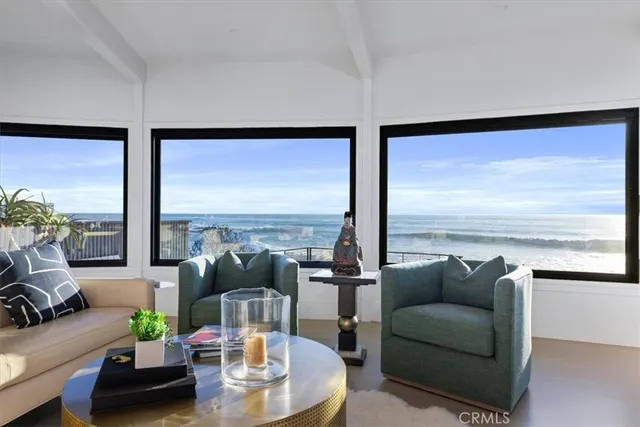 a dining hall with stainless steel appliances granite countertop a dining table and chairs