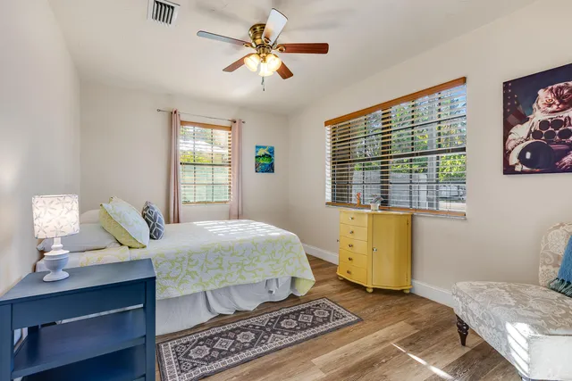 a living room with a bed furniture and a window