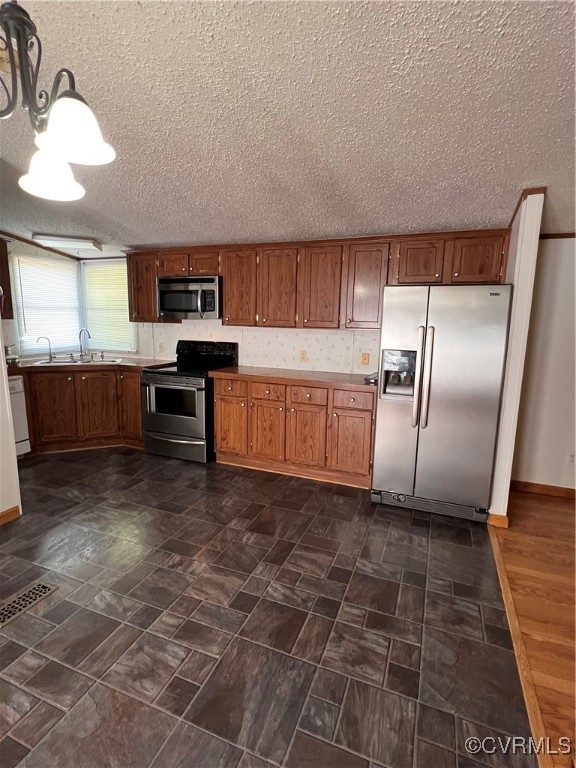 26 Manteo Road Buckingham, VA 23921 - Photo 4 of 9 a kitchen with granite countertop a refrigerator a stove a sink and dishwasher