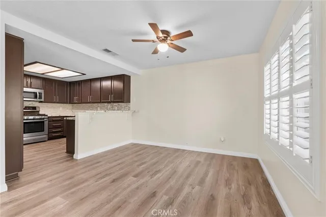 a view of a kitchen with microwave and cabinets