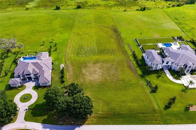 a view of a lake with houses in the back