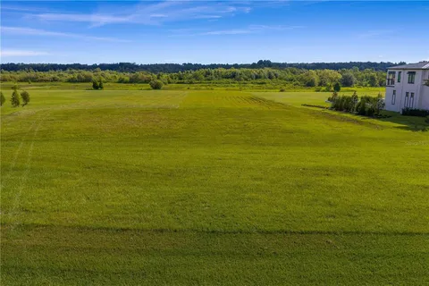 a view of a street with a building in the background