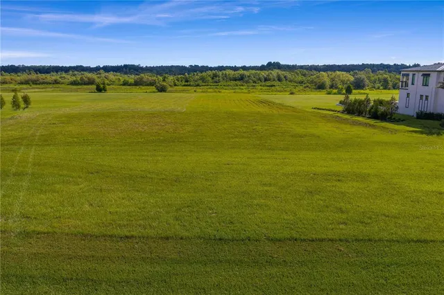 a view of a street with a building in the background