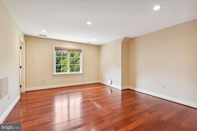 an aerial view of a house with a yard and swimming pool