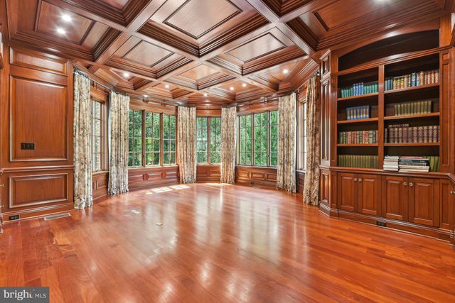 a large kitchen with kitchen island granite countertop a large counter top and stainless steel appliances