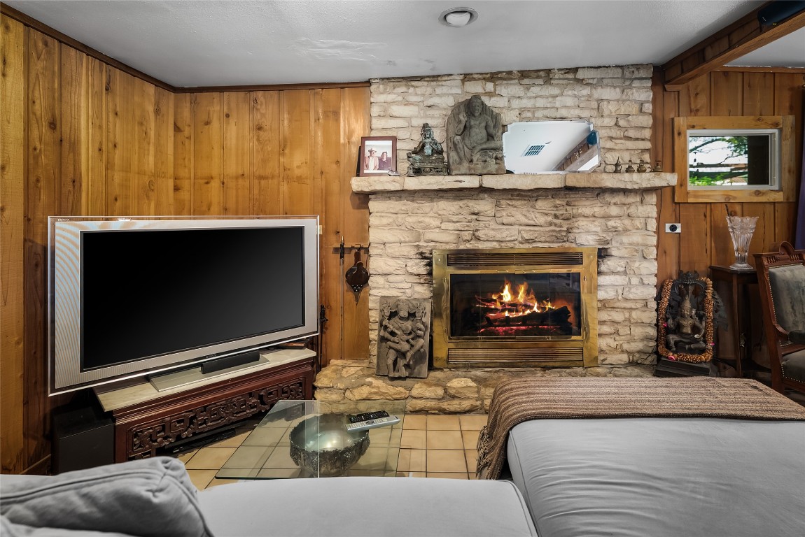 16020 Pool Canyon Road Austin, TX 78734 - Photo 4 of 18 a living room with furniture a flat screen tv and a fireplace