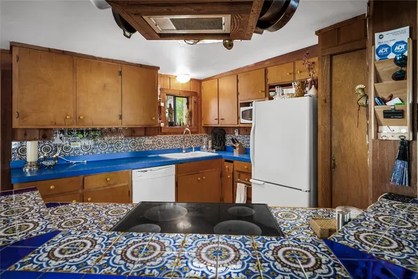 a kitchen with a refrigerator and a sink