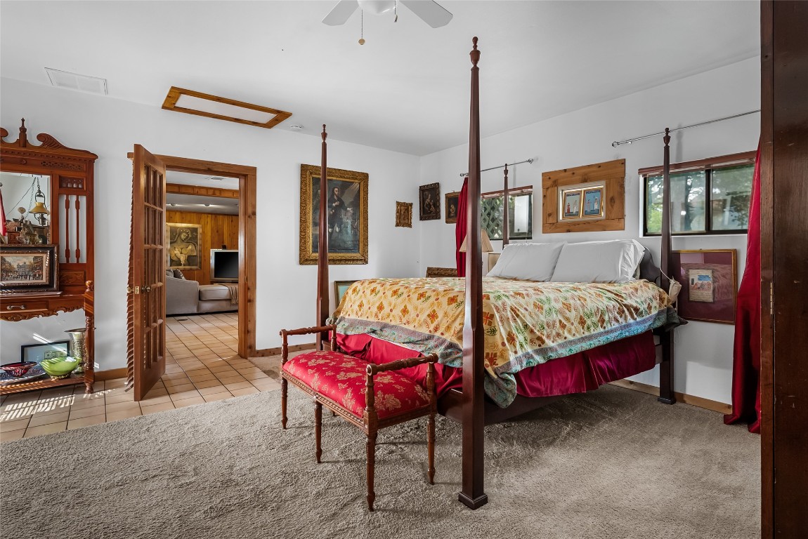 16020 Pool Canyon Road Austin, TX 78734 - Photo 10 of 18 a bedroom with a bed a table and chair