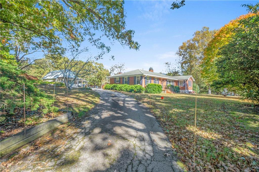 3749 Centerville Rosebud Road Snellville, GA 30039 - Photo 2 of 77 a view of a house with a yard