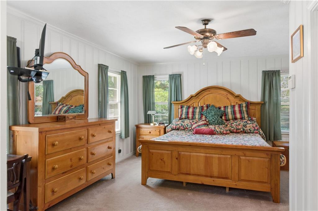 3749 Centerville Rosebud Road Snellville, GA 30039 - Photo 24 of 77 a bedroom with a bed and a dresser