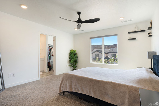 1693 Devils Gdn Lane Washington, UT 84780 - Photo 24 of 64 Bedroom featuring a large window, recessed lighting, and a ceiling fan