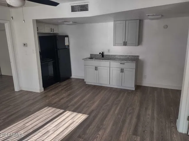 a kitchen with a sink and cabinets