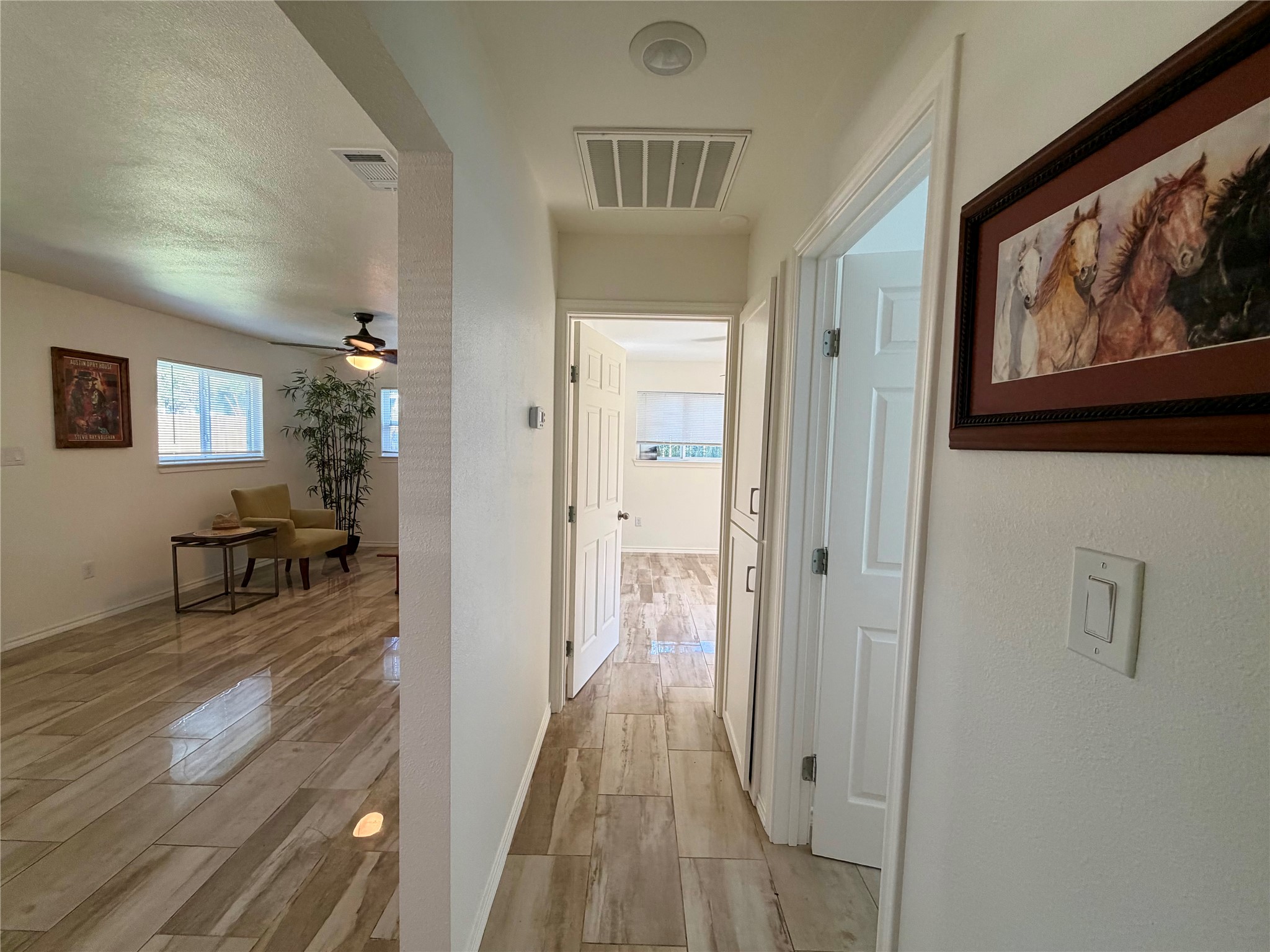 301 Sheraton Avenue Austin, TX 78745 - Photo 5 of 27 Clean, open layout with seamless flow and sparkling flooring throughout.