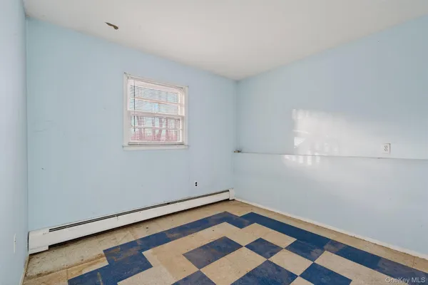 a room with window and ceiling fan