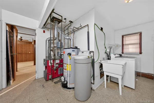 a room filled with furniture a washer and dryer