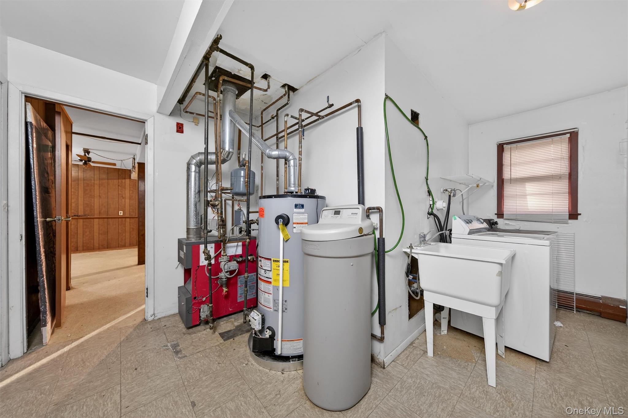 53 Mallory Road Spring Valley, NY 10977 - Photo 28 of 33 Utility room featuring washer / dryer, gas water heater, and a heating unit