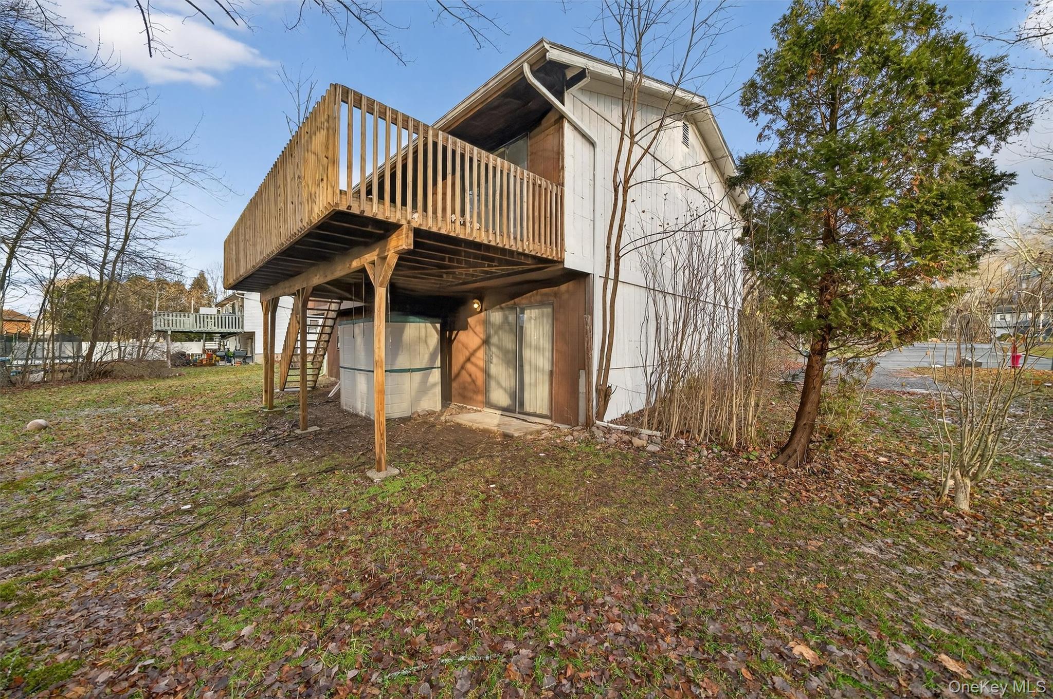 53 Mallory Road Spring Valley, NY 10977 - Photo 32 of 33 Back of house with stairs and a wooden deck