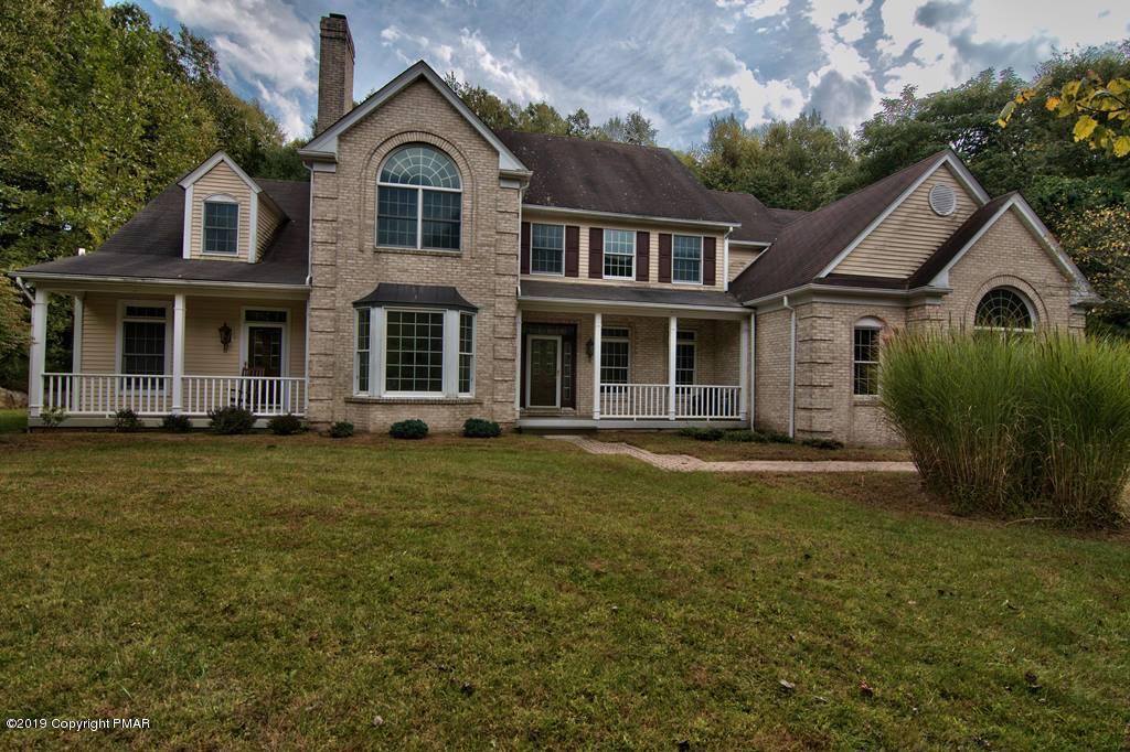 2169 Fox Run Road Stroudsburg, PA 18360 - Photo 1 of 66 a front view of a house with a garden