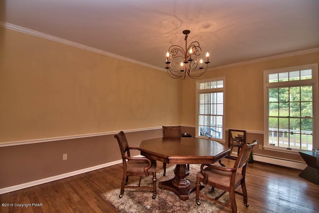 2169 Fox Run Road Stroudsburg, PA 18360 - Photo 11 of 66 a view of a dining room with furniture and wooden floor