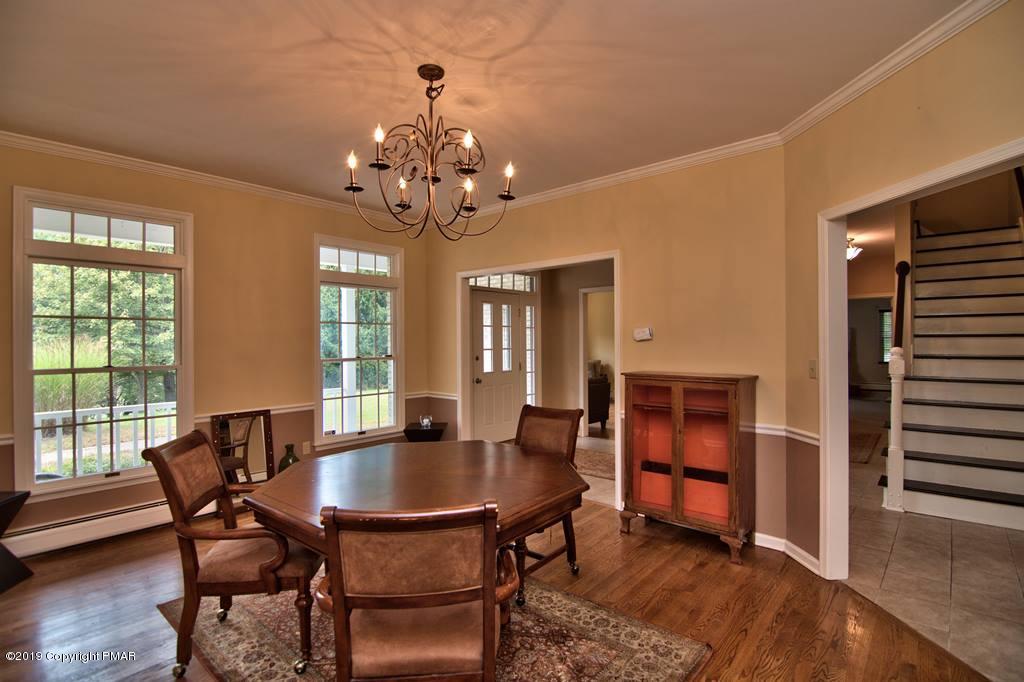 2169 Fox Run Road Stroudsburg, PA 18360 - Photo 12 of 66 a view of a dining room with furniture window and wooden floor