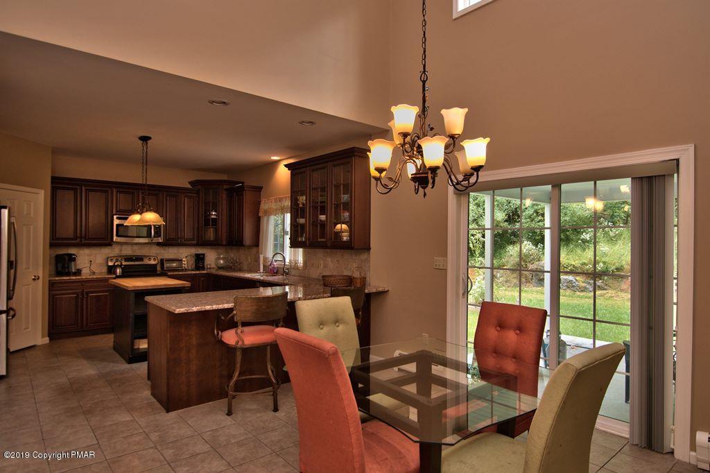 2169 Fox Run Road Stroudsburg, PA 18360 - Photo 13 of 66 a dining room filled with furniture and chandelier