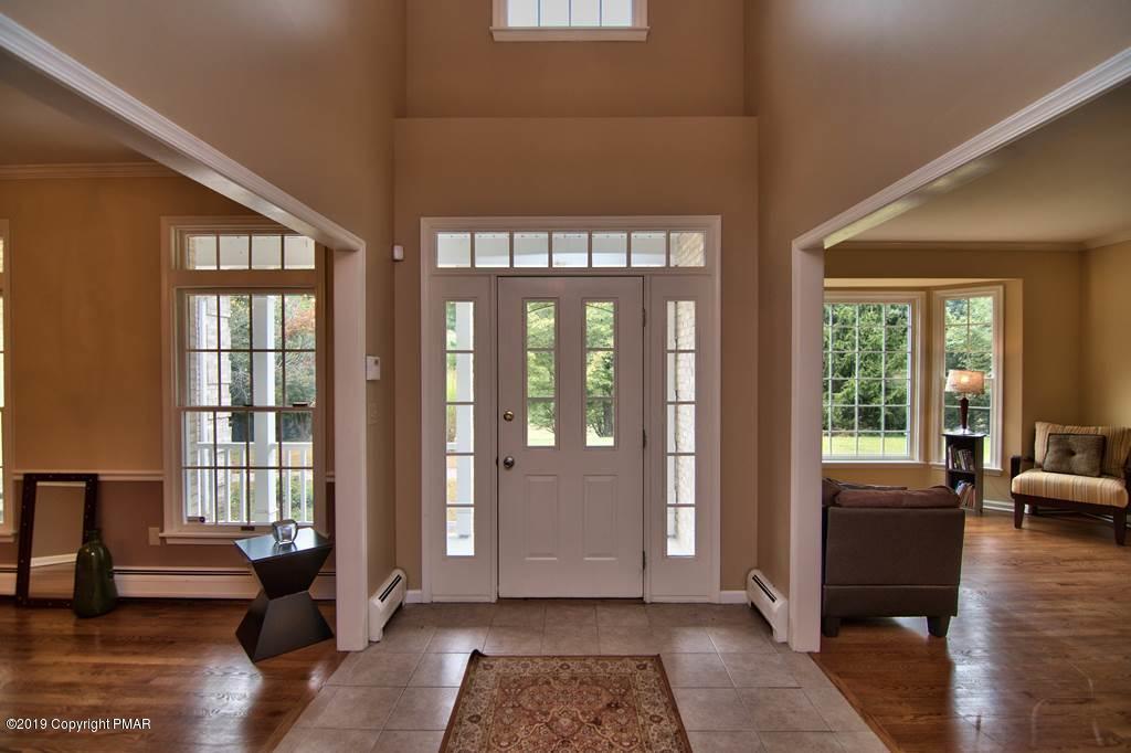 2169 Fox Run Road Stroudsburg, PA 18360 - Photo 2 of 66 a living room with furniture and large windows