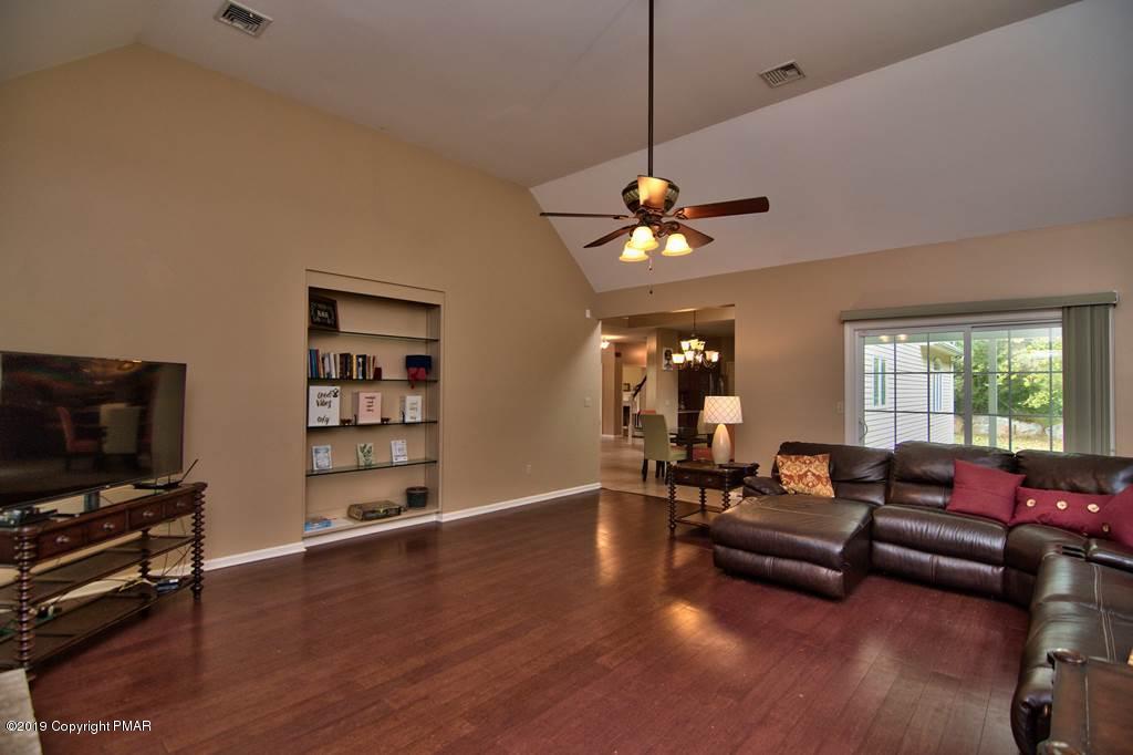 2169 Fox Run Road Stroudsburg, PA 18360 - Photo 23 of 66 a living room with furniture and a flat screen tv
