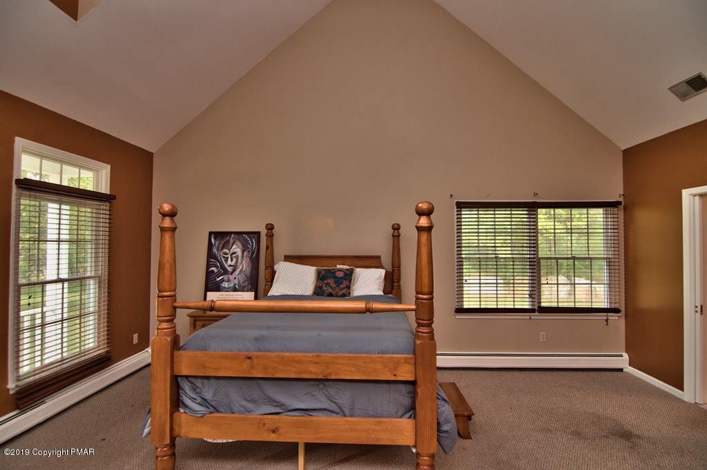 2169 Fox Run Road Stroudsburg, PA 18360 - Photo 27 of 66 a bedroom with furniture and a window
