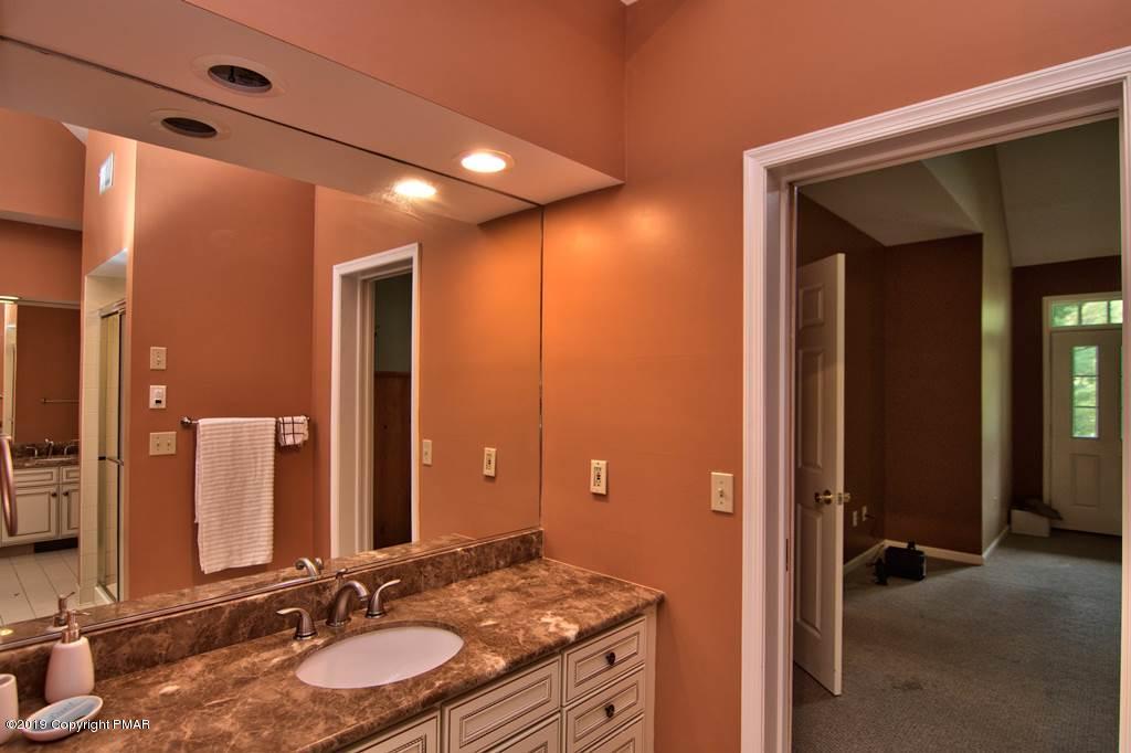 2169 Fox Run Road Stroudsburg, PA 18360 - Photo 33 of 66 a bathroom with a granite countertop sink and a mirror