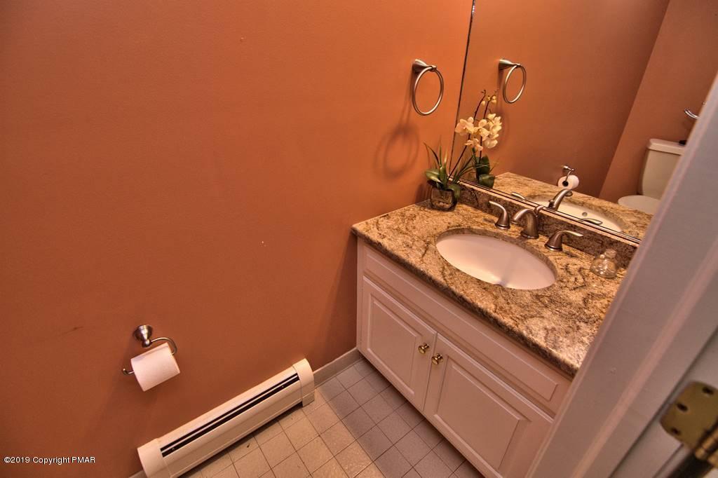 2169 Fox Run Road Stroudsburg, PA 18360 - Photo 34 of 66 a bathroom with a sink and a mirror