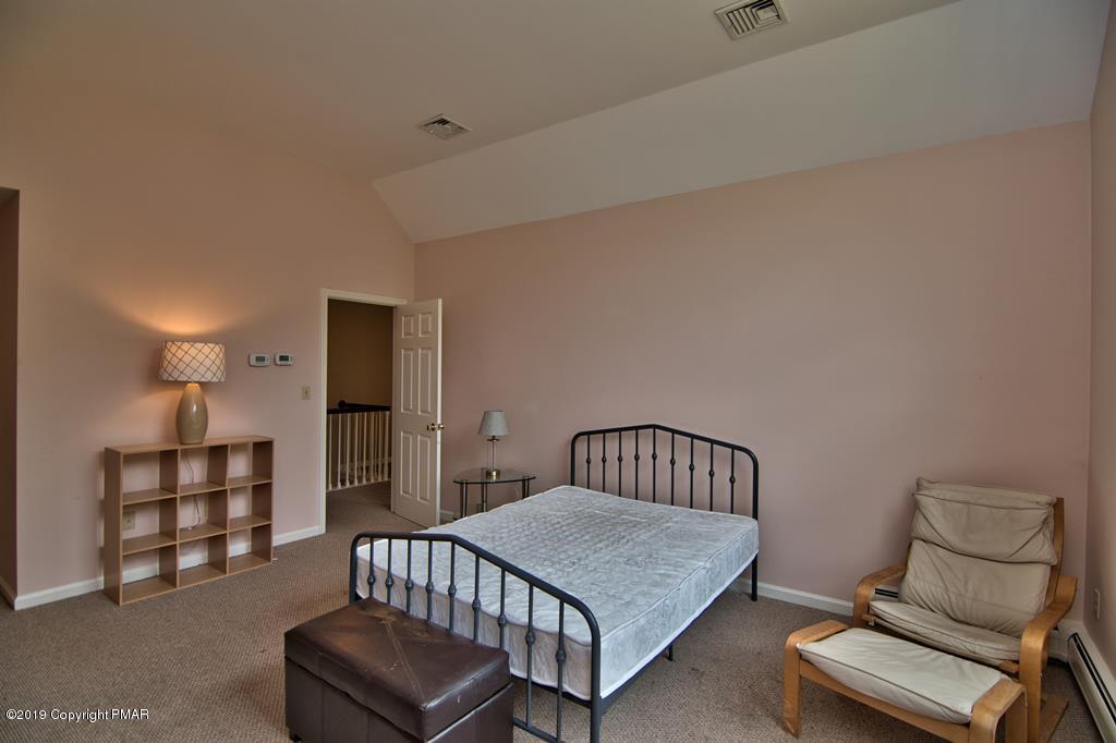2169 Fox Run Road Stroudsburg, PA 18360 - Photo 38 of 66 a bedroom with furniture and a window