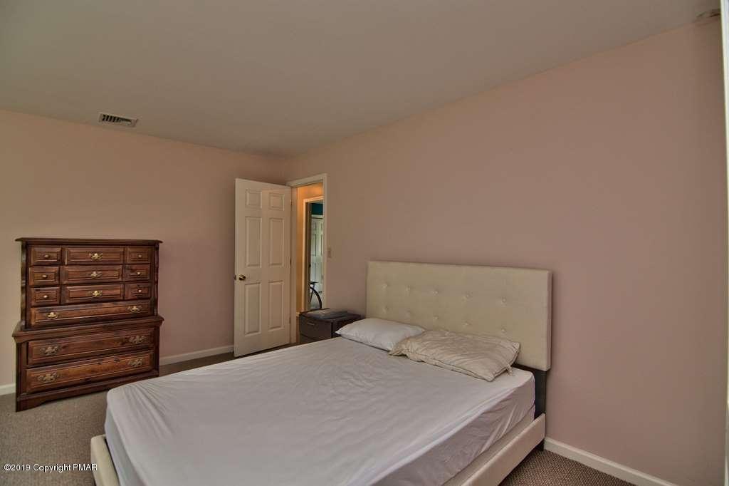 2169 Fox Run Road Stroudsburg, PA 18360 - Photo 43 of 66 a bedroom with a bed and a dresser