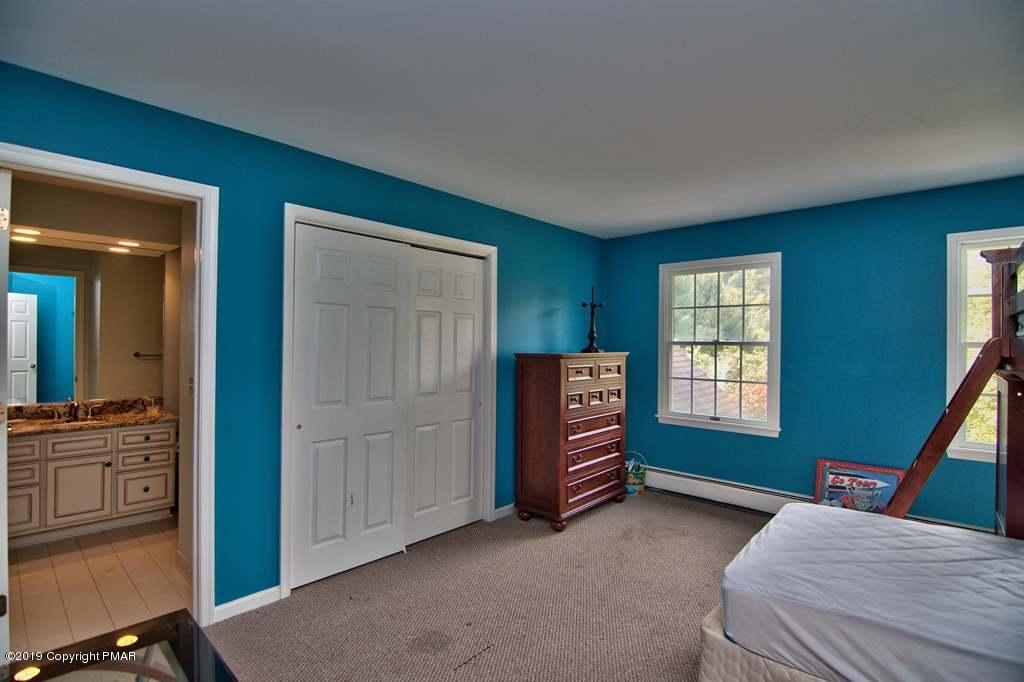 2169 Fox Run Road Stroudsburg, PA 18360 - Photo 48 of 66 a bedroom with furniture and a window