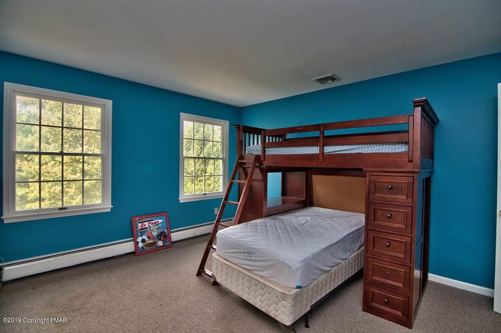 2169 Fox Run Road Stroudsburg, PA 18360 - Photo 49 of 66 a bedroom with a bed and a window
